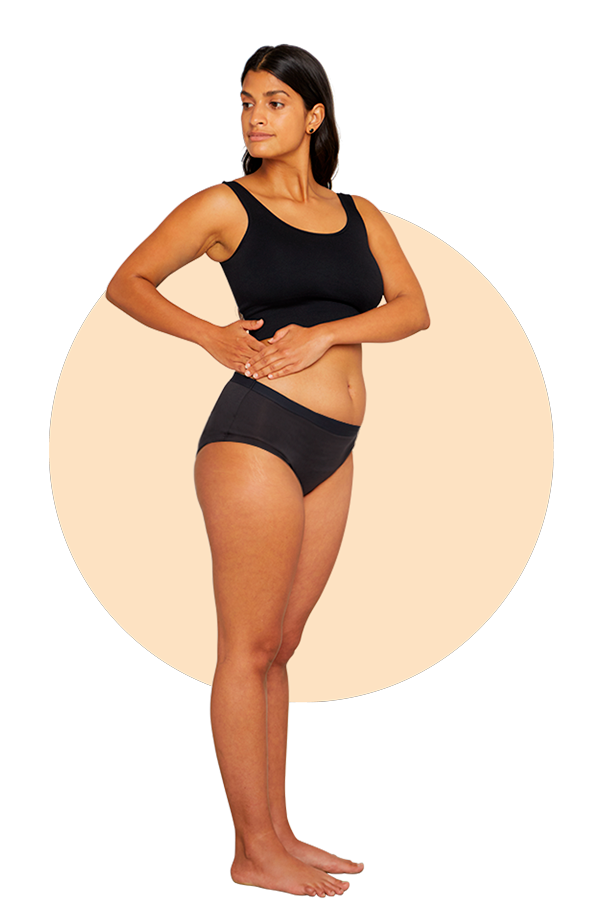 Woman wearing Thinx hiphugger in the color black.