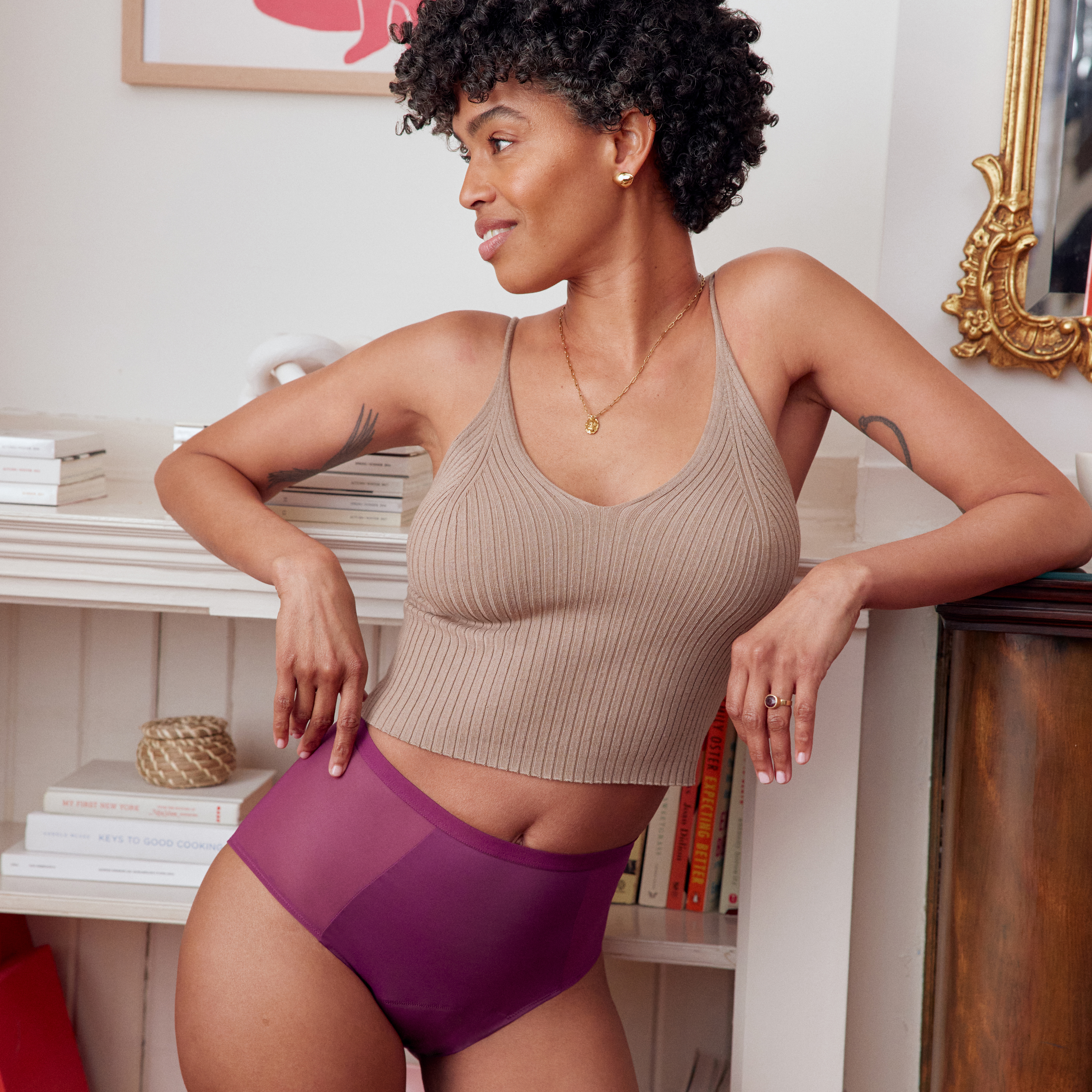 model wearing a pair of Thinx comfort stretch hi-waist in plum