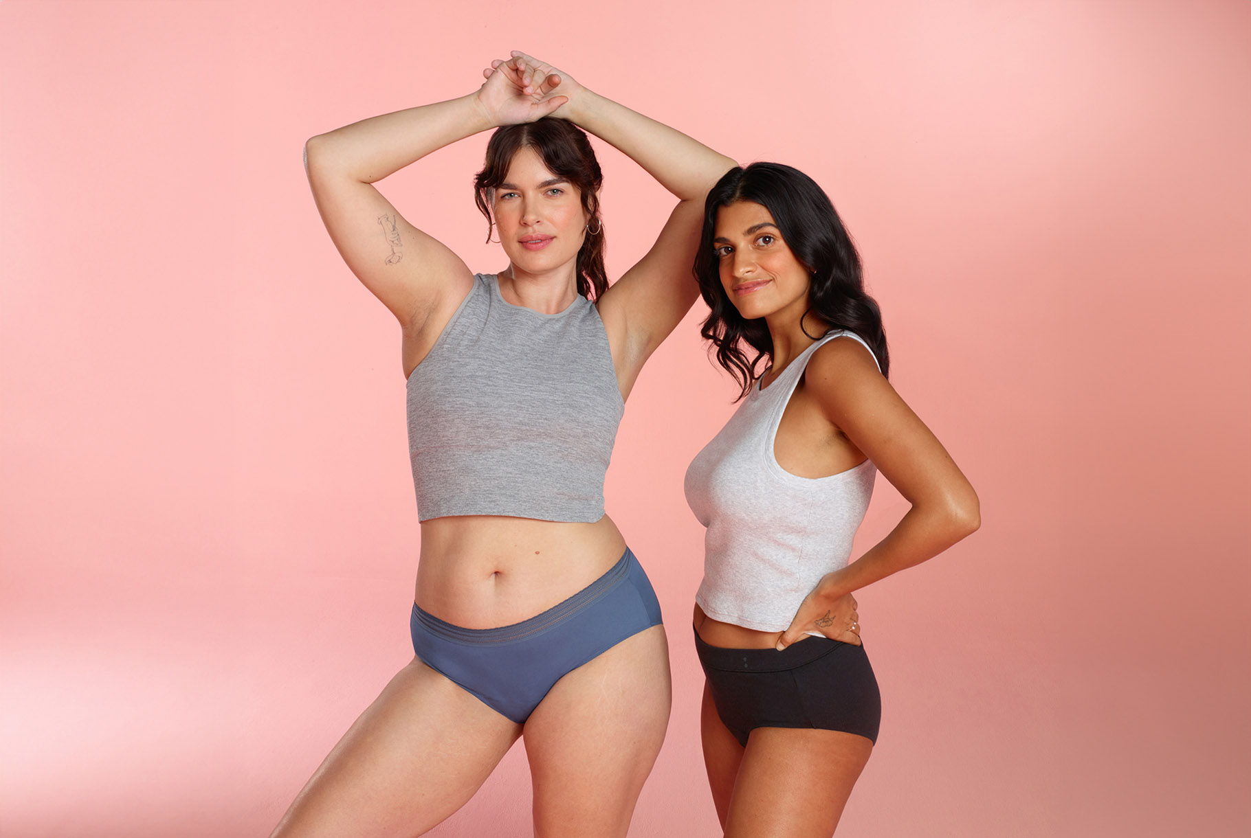 Two women standing next to each other in Thinx for All underwear.